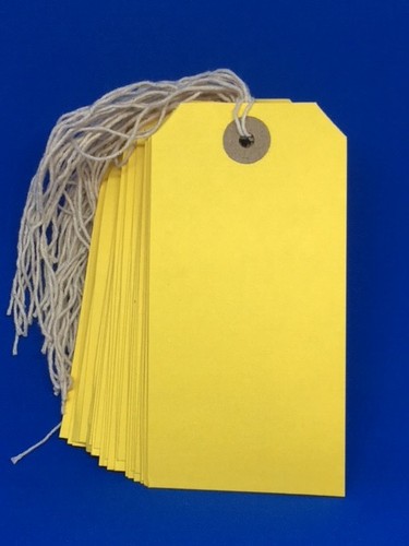 Yellow strung tie tags - tie, on